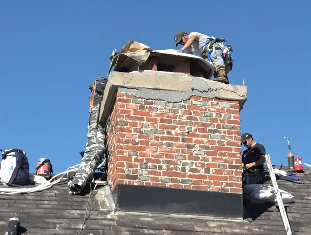 Laguna Hills Chimney Sweep installing a custom chimney crown in Laguna Hills, CA