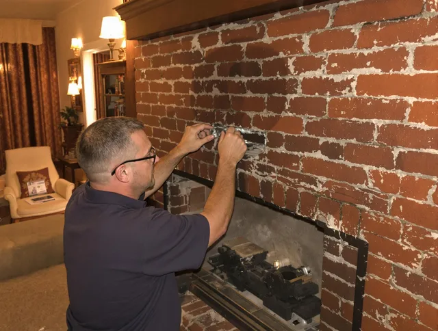 Laguna Hills Chimney Sweep expert fixing a fireplace in Laguna Hills, CA